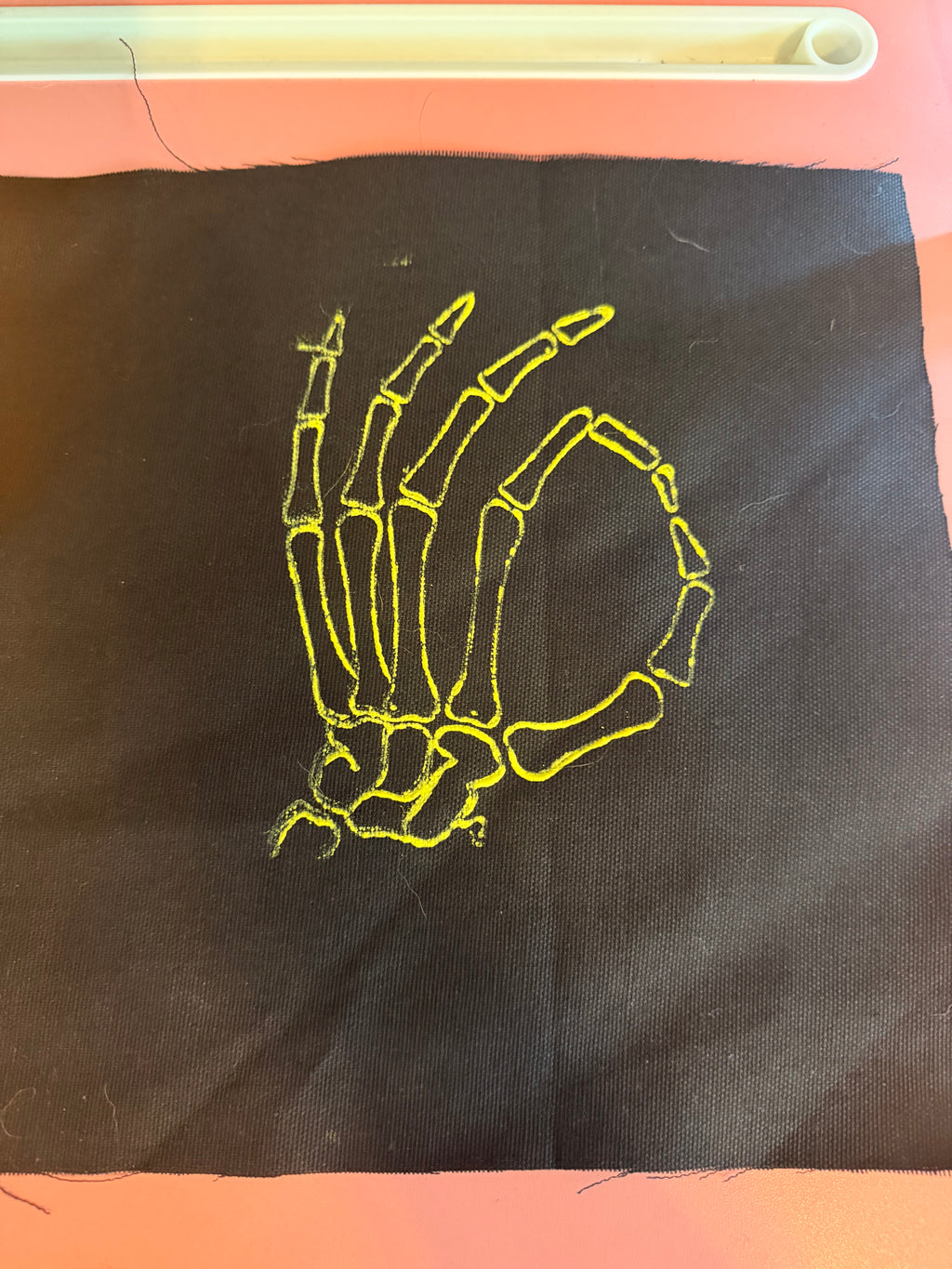 Custom embroidery pattern on stamped fabric