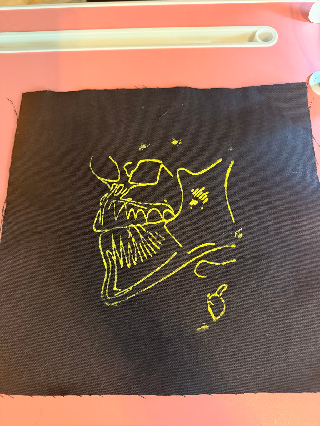 Custom embroidery pattern on stamped fabric